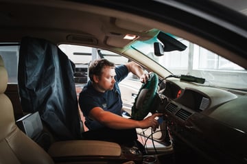 Power steering technician checking EPS issues with a diagnostic scan tool